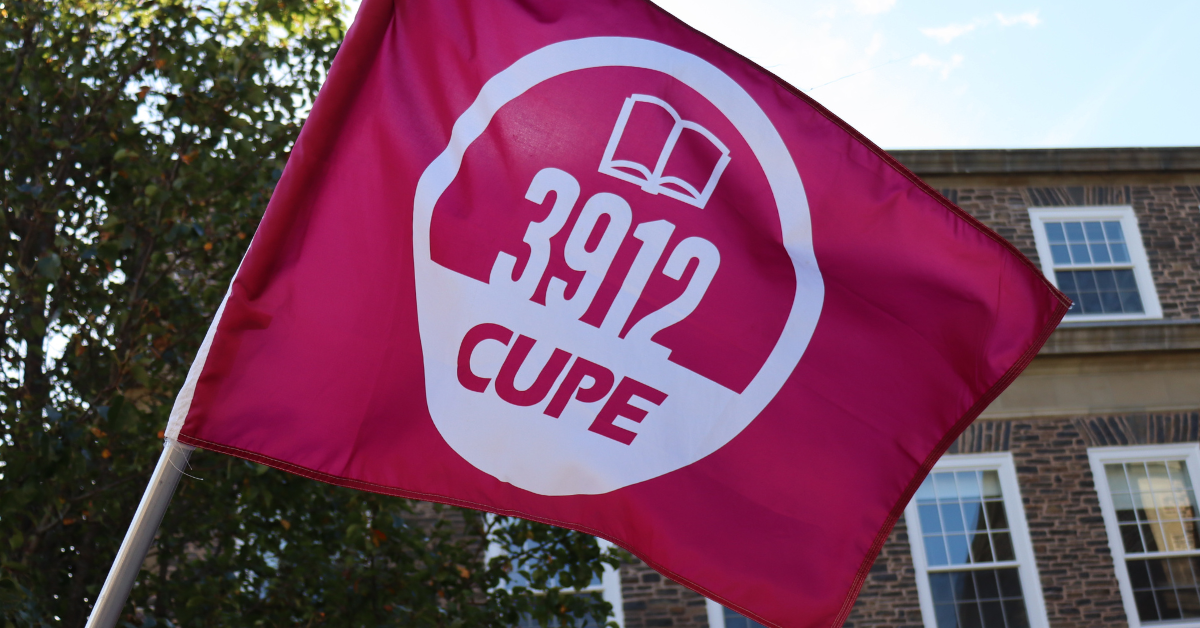 CUPE 3912 flag outside a brick building at Dalhousie University
